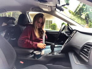 Girl with T1D buckling seatbelt